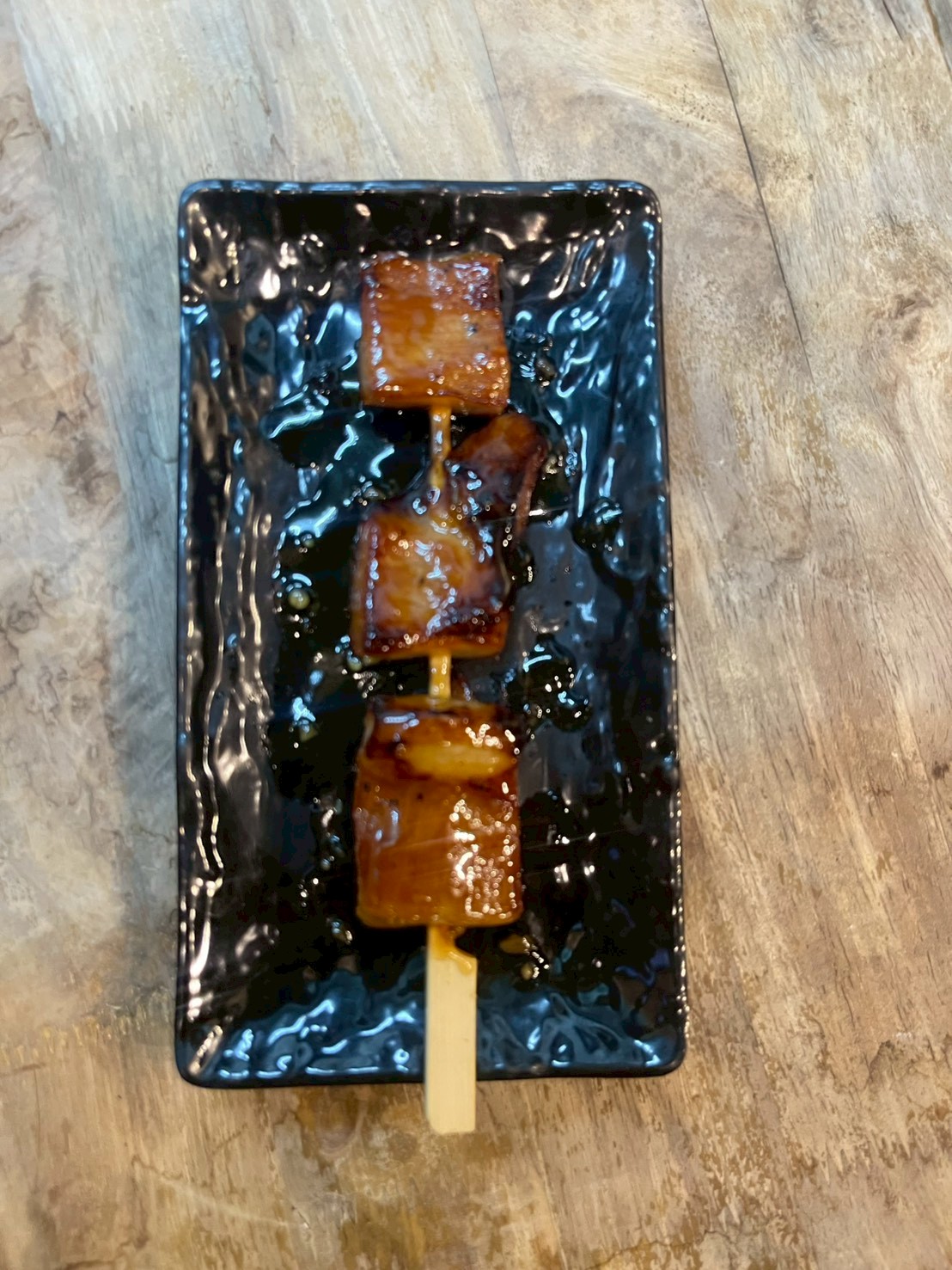 คอหมูเสียบไม้